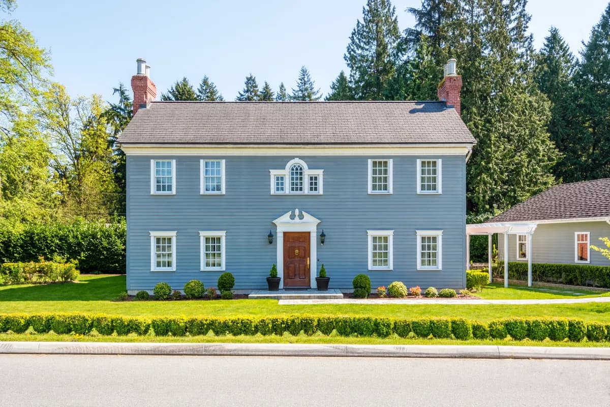 Manicured lawn and healthy trees at a DMV home